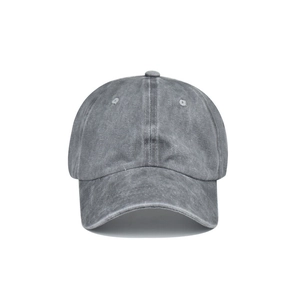 Close-up of vintage dark gray washed cotton fabric and embroidery eyelets on a ponytail cap