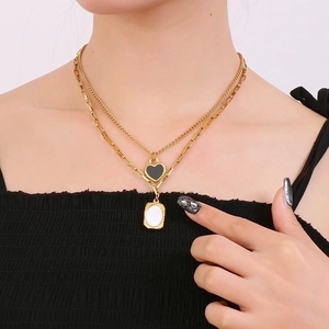 French vintage double-layered necklace with black heart and white marble oval pendants