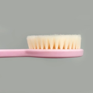 Pink long handle bath brush with dense soft bristles for gentle body cleaning