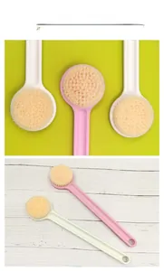 Detailed close-up of soft round brush head and long handle body brush for bath