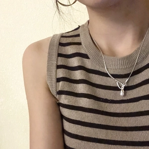 Elegant S925 sterling silver necklace with teardrop freshwater pearl on a female model
