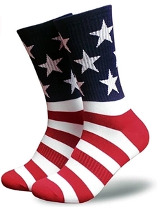 Detail of USA flag socks showing deep blue star pattern and red stripes on cotton fabric