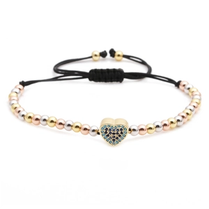 Detail of heart charm with blue zircons on tricolor beaded bracelet with adjustable cord