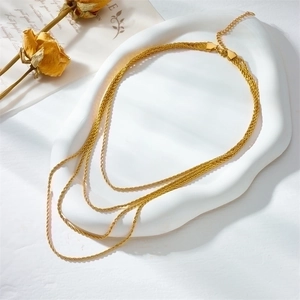 Three-layer golden rope chain necklace in titanium steel with a layered punk design