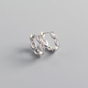 Macro detail of S925 silver hoop earrings featuring sparkling marquise-cut zircons