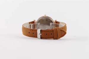 Detail of the brown suede strap and silver buckle on this starry sky quartz watch