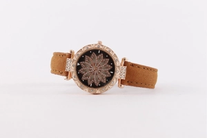 Detail view of rose gold watch case with hollow flower dial and crystal encrusted rhinestones
