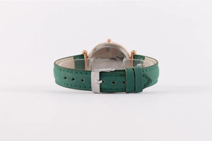 Detail view of the stainless steel back cover and dark green leather strap with pin buckle