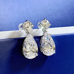 Elegant 925 sterling silver drop earrings with pear-cut zircon crystals on blue background