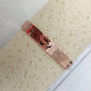 Men's copper magnetic therapy bracelet with adjustable wave design in rose gold finish
