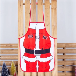 Close-up of Santa Claus costume print and HO HO HO text on red Christmas apron