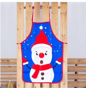 Detail showing blue Christmas apron with snowman print hanging on a wooden stand