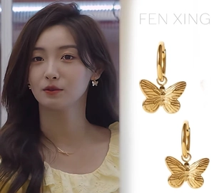 Gold butterfly hoop earrings for women with delicate wing texture details