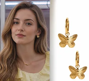 Gold butterfly hoop earrings for women with delicate wing texture details