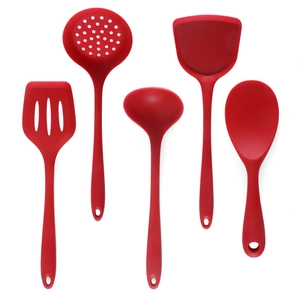 Five-piece red silicone kitchen utensil set including spatula and spoons on white background