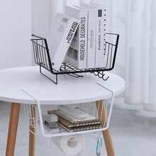 Detail of expandable stainless steel kitchen sink rack holding fresh vegetables and fruits