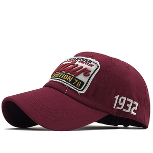 Macro detail of wine red vintage baseball cap featuring white wave and 1932 side embroidery