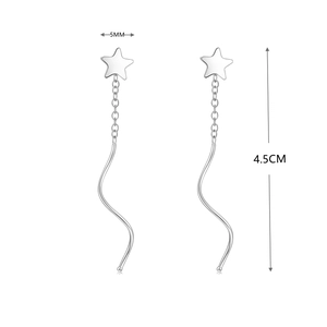 Detailed view of silver star earrings with wavy drop line, 4.5cm length and 5mm width