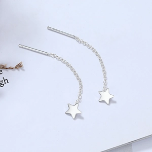 Detail of S925 sterling silver star threader earrings with sleek tassel chain design
