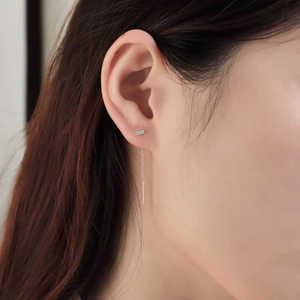 Detail of s925 sterling silver threader earring with long geometric bar and fringe chain