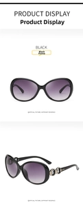 Detail view of black oversized sunglasses with gradient purple lenses and metal buckle