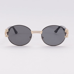 Lunettes de soleil ovales rétro avec monture dorée à double pont et verres foncés style urbain