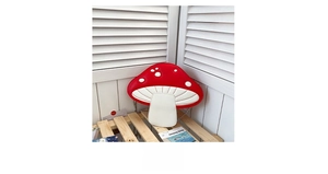 Detailed view of the red and white mushroom-shaped chain bag with silver shoulder strap