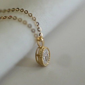 S925 silver gold plated necklace with oval clear gemstone and milgrain bezel pendant