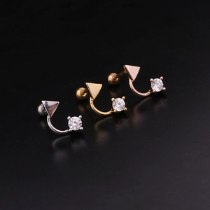 Detailed view of cross cartilage earrings in silver, gold, and rose gold with cubic zirconia