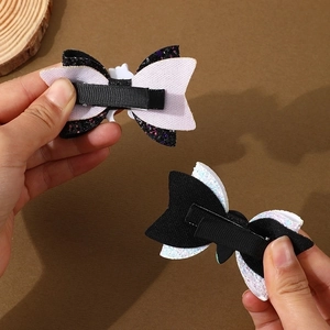 Halloween bow hair clips with black and white glitter finish and sturdy alligator clips