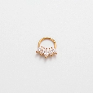Macro shot of 16G gold nose ring with five marquise-cut marquise cubic zirconia stones