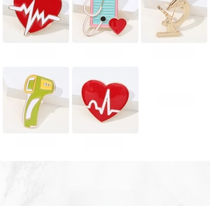 Macro view of five medical enamel pins including thermometer and microscope designs