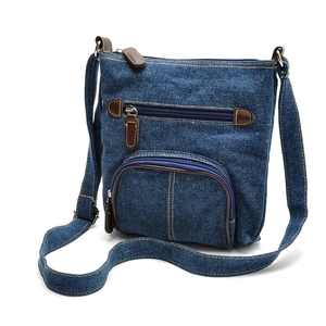 Classic blue denim crossbody bag with brown leather accents and multiple pockets on white background