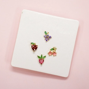 Macro shot of 925 silver fruit stud earrings featuring colorful cubic zirconia on base