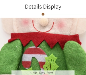 Detail of high quality felt gingerbread man cutlery holder with candy cane and holly leaf