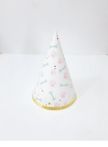 Close-up of white party cone hat with pink paw prints and gold foil scalloped edge