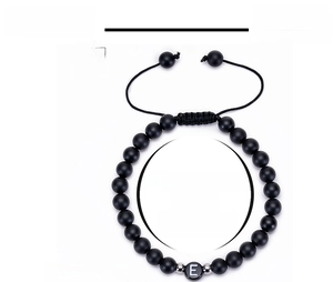 Detail showing 6mm matte onyx beads with letter E charm and adjustable woven cord