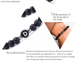 Macro detail of 6mm matte agate beads and custom letter beads on a woven bracelet