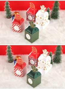 Detail of Christmas candy boxes with festive patterns on white faux fur background