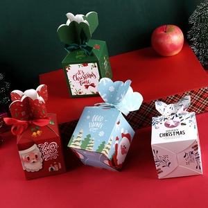 Festive Christmas gift boxes in multiple colors with silk ribbons and holiday patterns