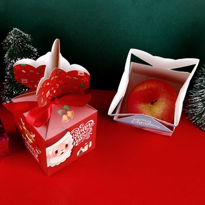 Christmas gift box for apples with Santa and reindeer patterns and red ribbons