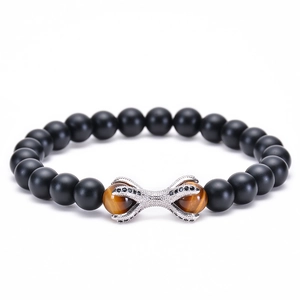 Detail of matte agate beads with tiger eye stones and silver dragon claw charm