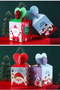 Detail view of colorful Christmas gift boxes with heart handles and cartoon patterns