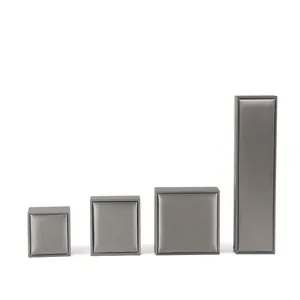 Set of four grey brushed PU leather jewelry boxes for rings necklaces and bracelets
