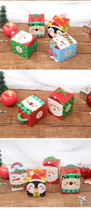 Close-up of festive Christmas gift boxes with Santa and reindeer cartoon patterns
