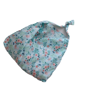 Floral cotton tote bag with knot handle featuring light blue and pink flower patterns