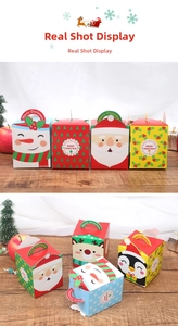 Detailed view of Christmas apple gift boxes featuring cartoon Santa and Reindeer designs