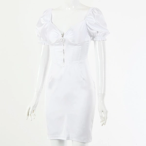 Detailed close-up of white satin dress featuring puffy sleeves and front zipper design
