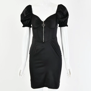 Detail of a black satin dress featuring a front zipper and puffy sleeves on a mannequin