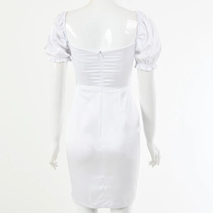 Detail view of white satin dress back showing invisible zipper and puff sleeves